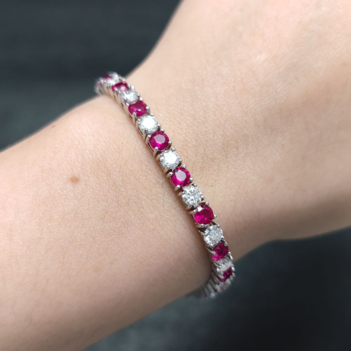 Lab-Grown Ruby 3/4/5mm Tennis Bracelet 925 Sterling Silver (wearing effect view)